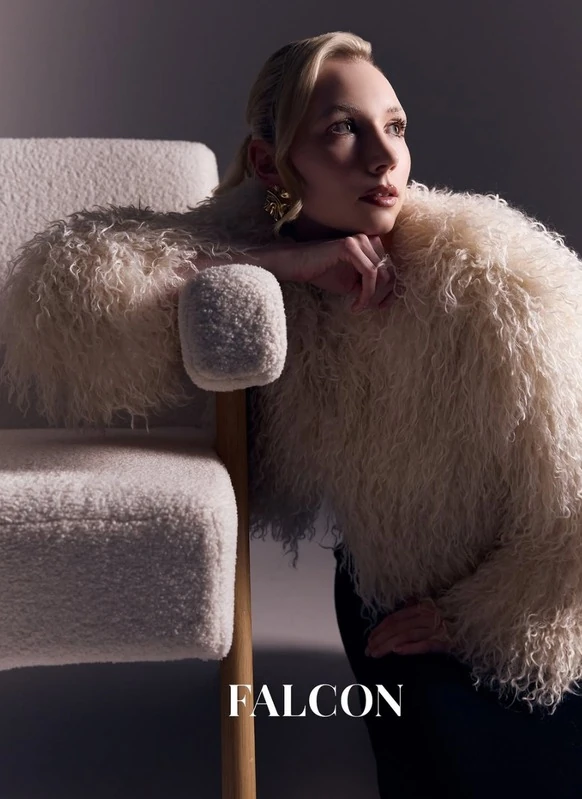 Falcon Magazine page: a model in a white shearling jacket leaning on a bouclé chair